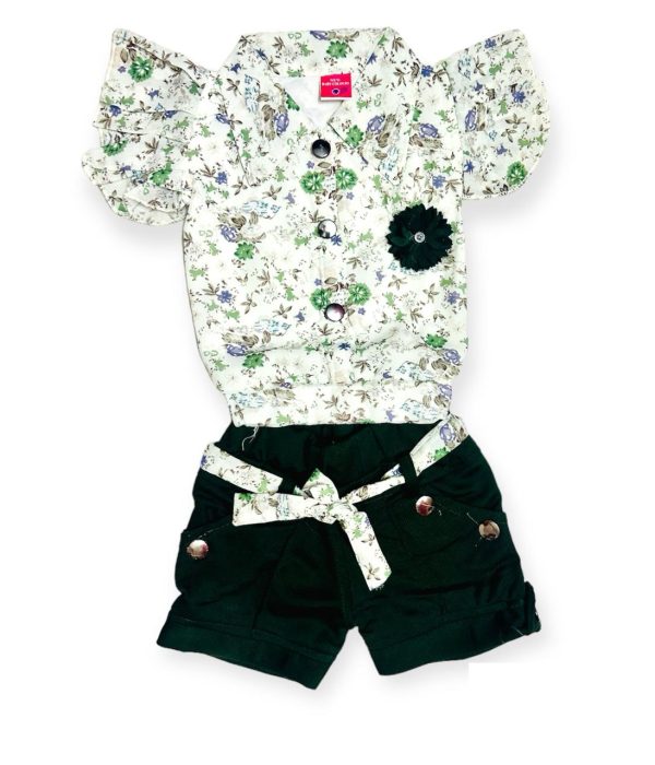 green floral top with dark green shorts